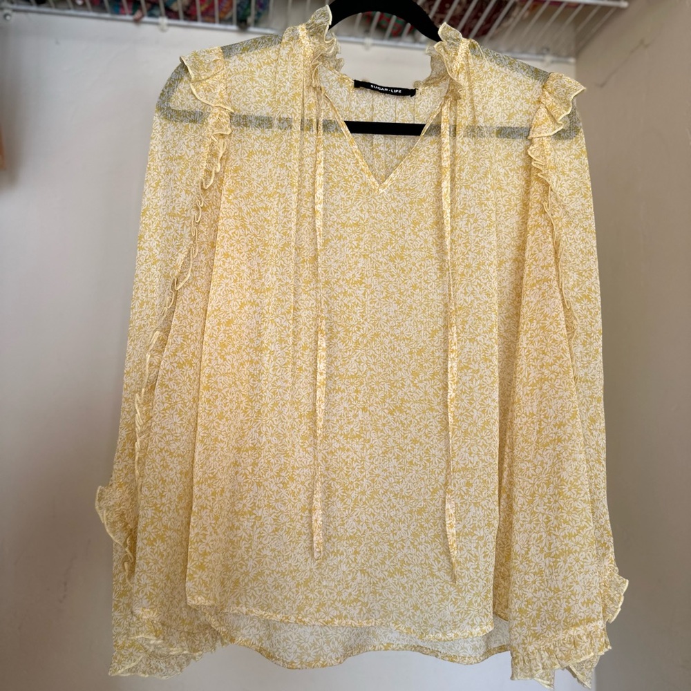 Yellow floral blouse with ruffle details